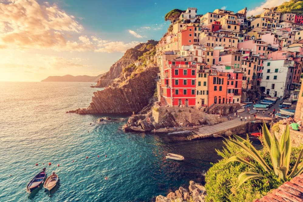Colourful Cinque Terre buildings overlooking the sea at sunset