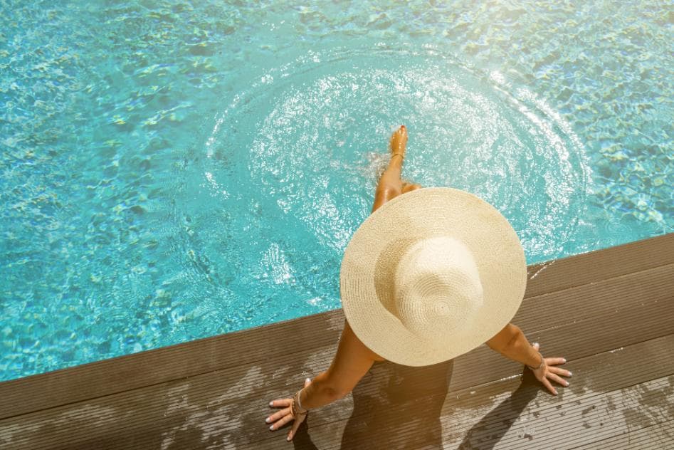 A sunlit pool with sparkling turquoise water